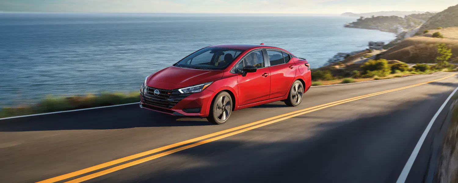 Nissan Versa driving on the road